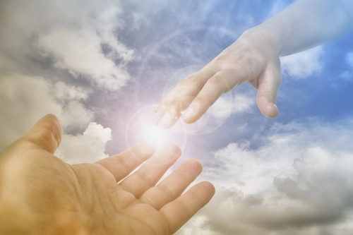 God's hand reaching out to man