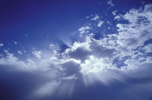 Heavenly light in white clouds and blue sky
