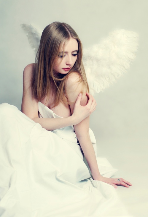 Young woman angel with wings